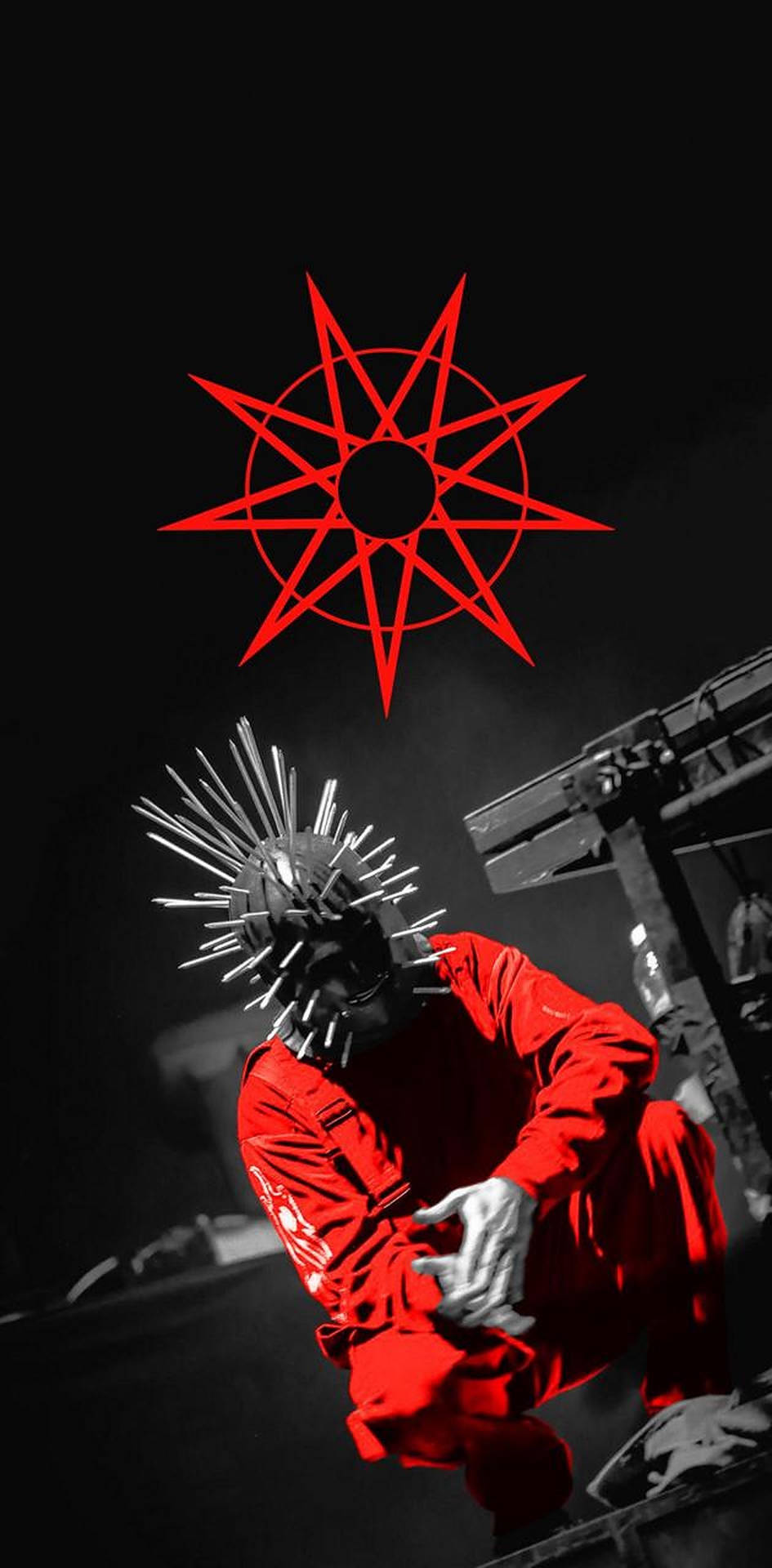 Craig Jones Of Slipknot With Iconic Red Logo Background