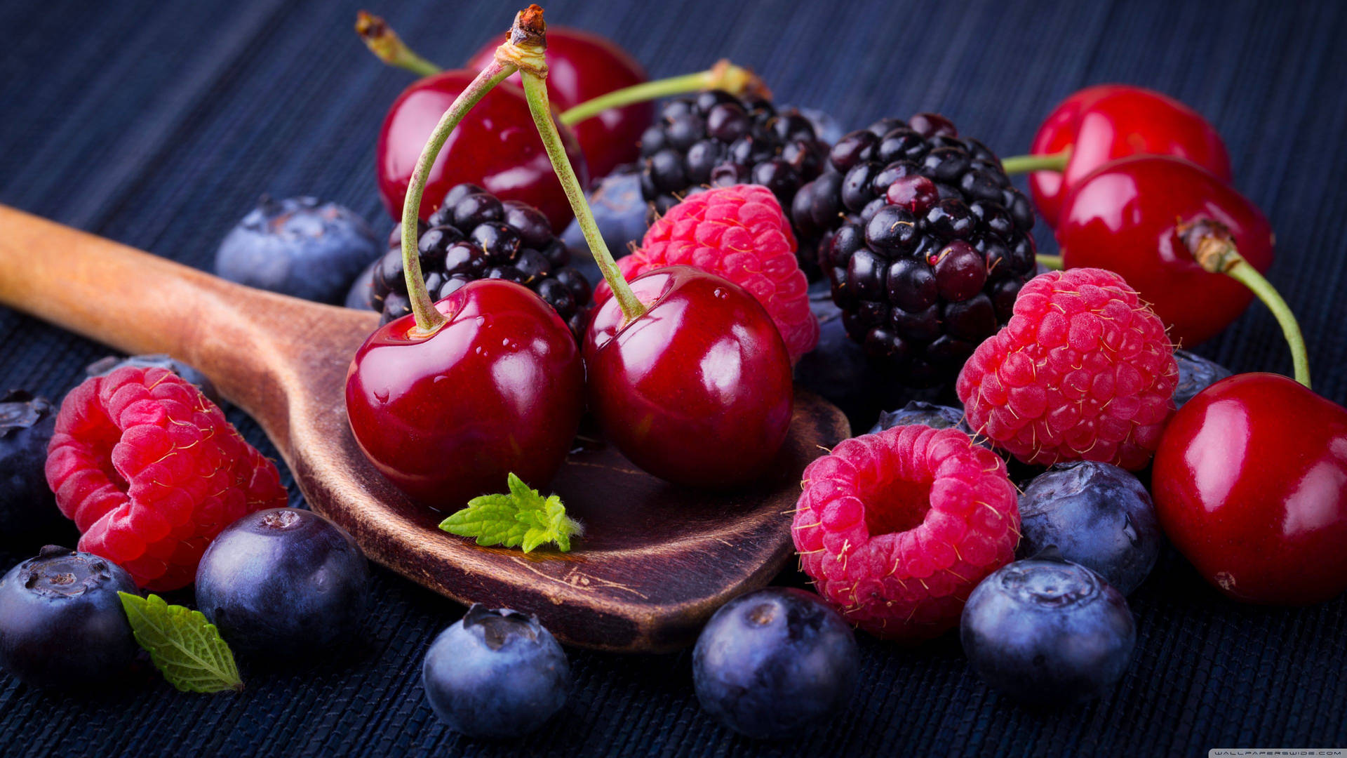 Cranberry Spoonful Of Mixed Berries Background