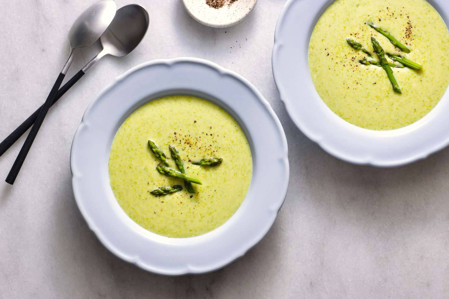 Creamy Asparagus Soup In A White Bowl Background