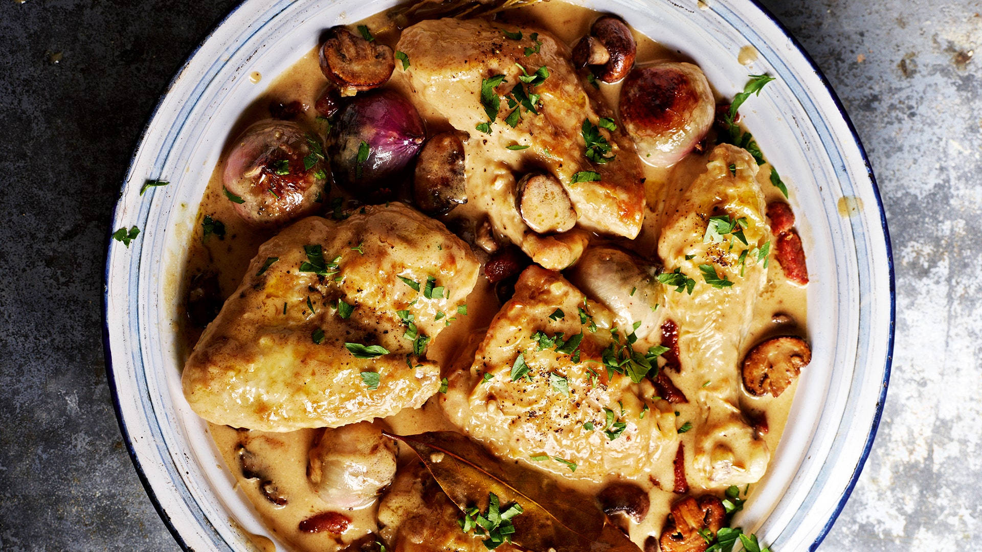 Creamy Coq Au Vin On A White Ceramic Plate