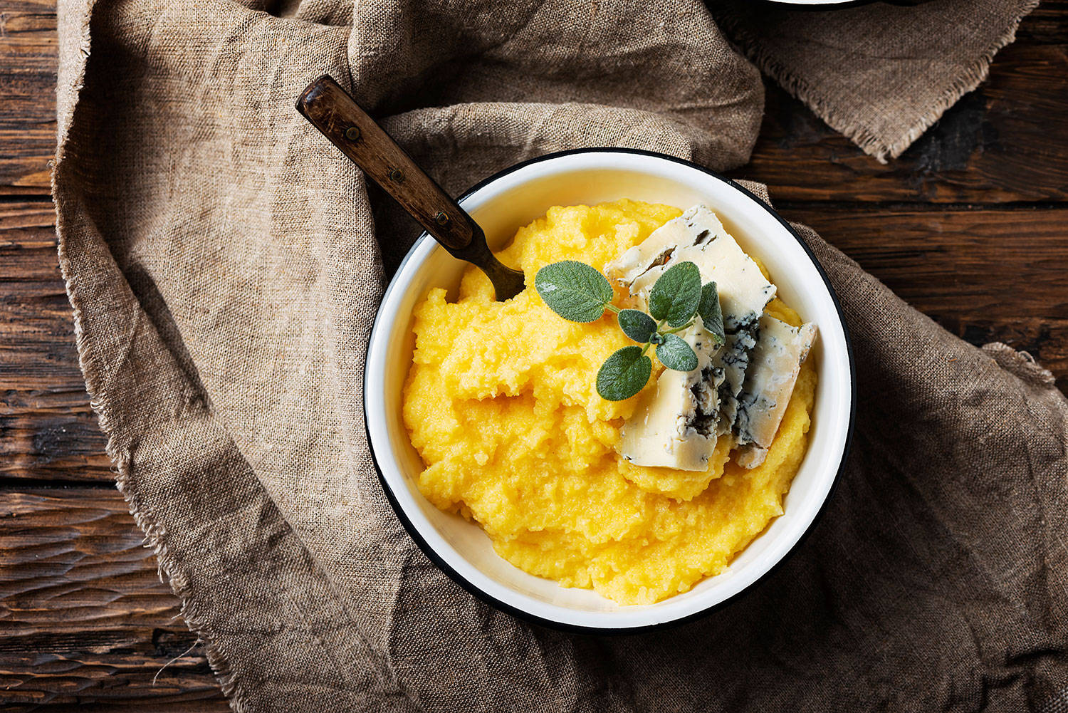 Creamy Gorgonzola Polenta Dish - An Artful Blend Of Italian Flavors Background