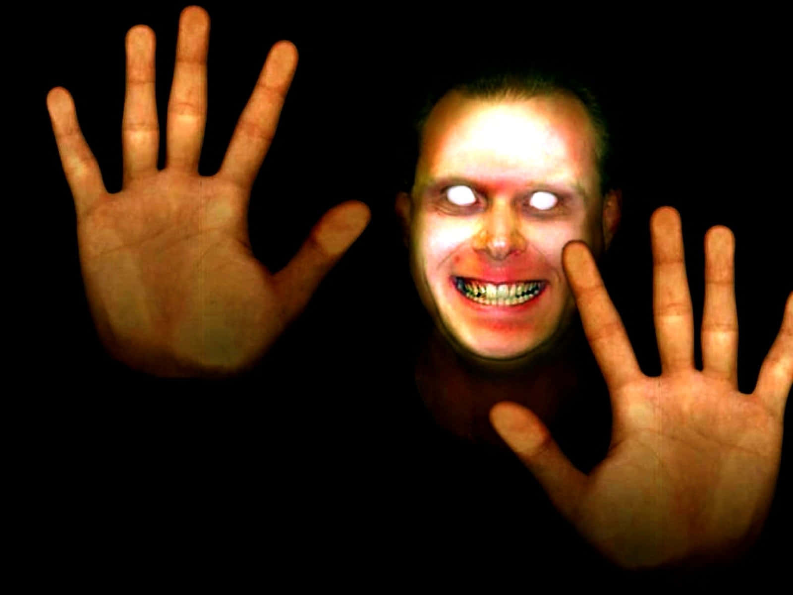 Creepy_ Smiling_ Face_and_ Hands Background