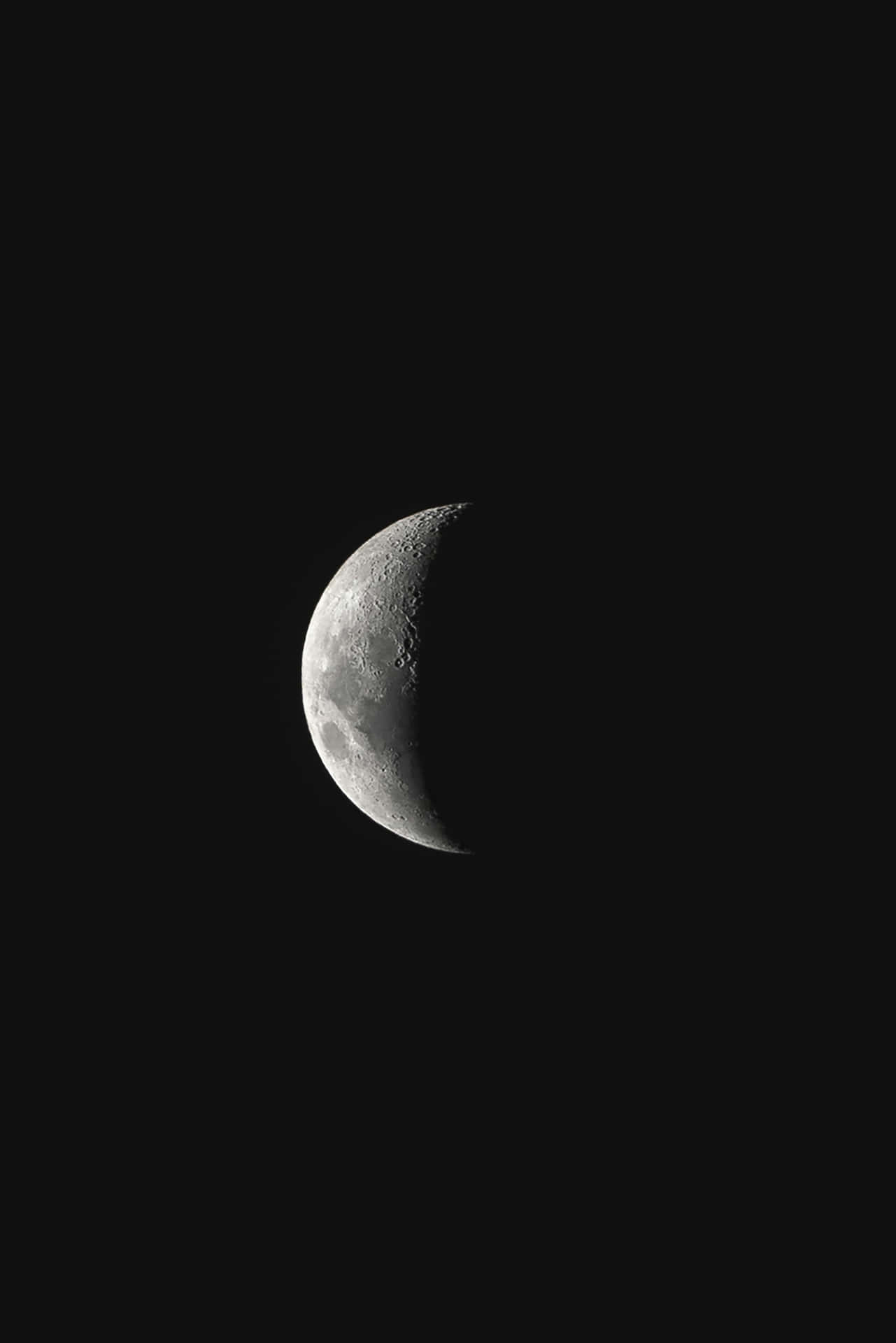 Crescent Moonin Dark Sky Background