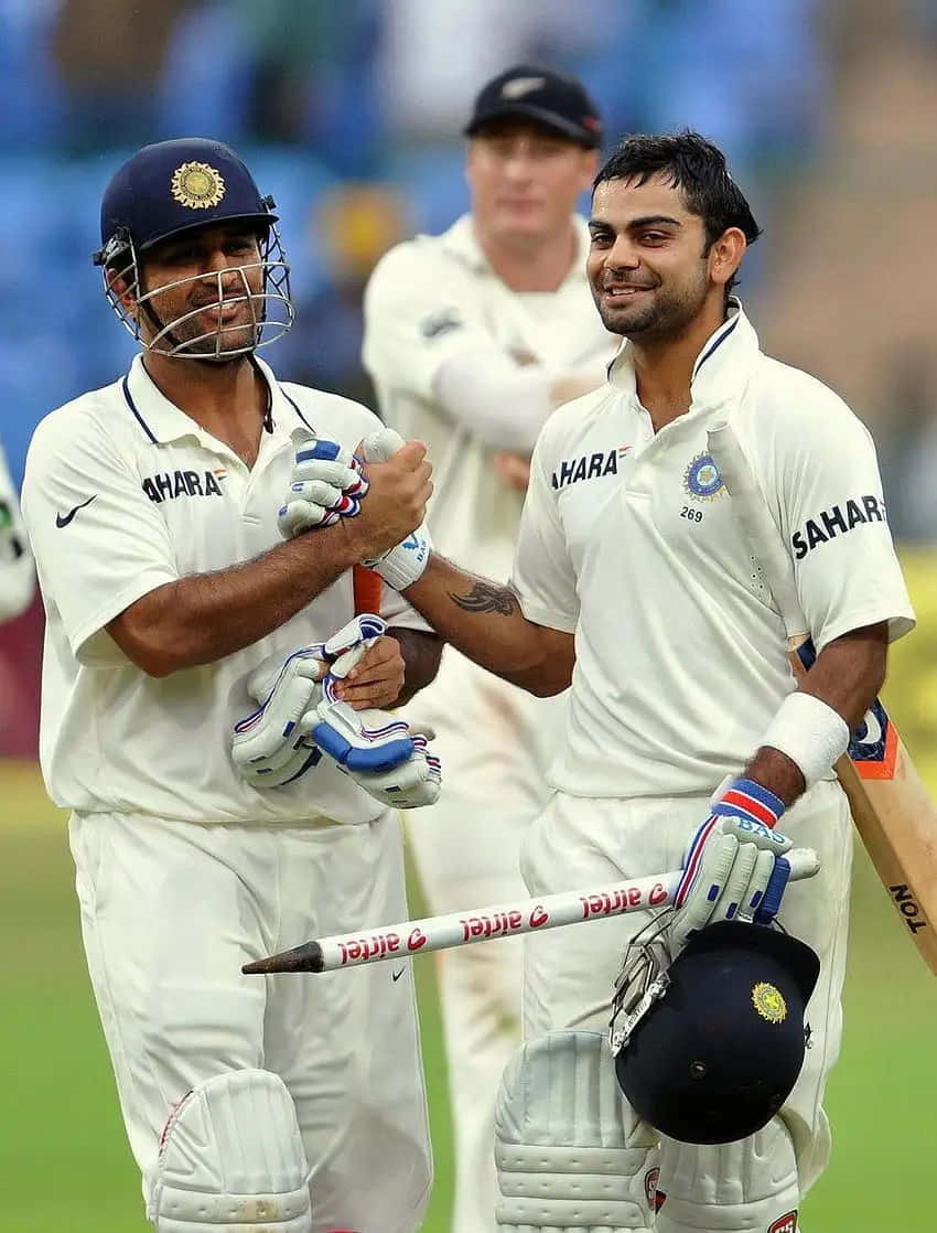 Cricketing_ Moments_ Virat_ Kohli_ Celebration_ With_ Teammate Background