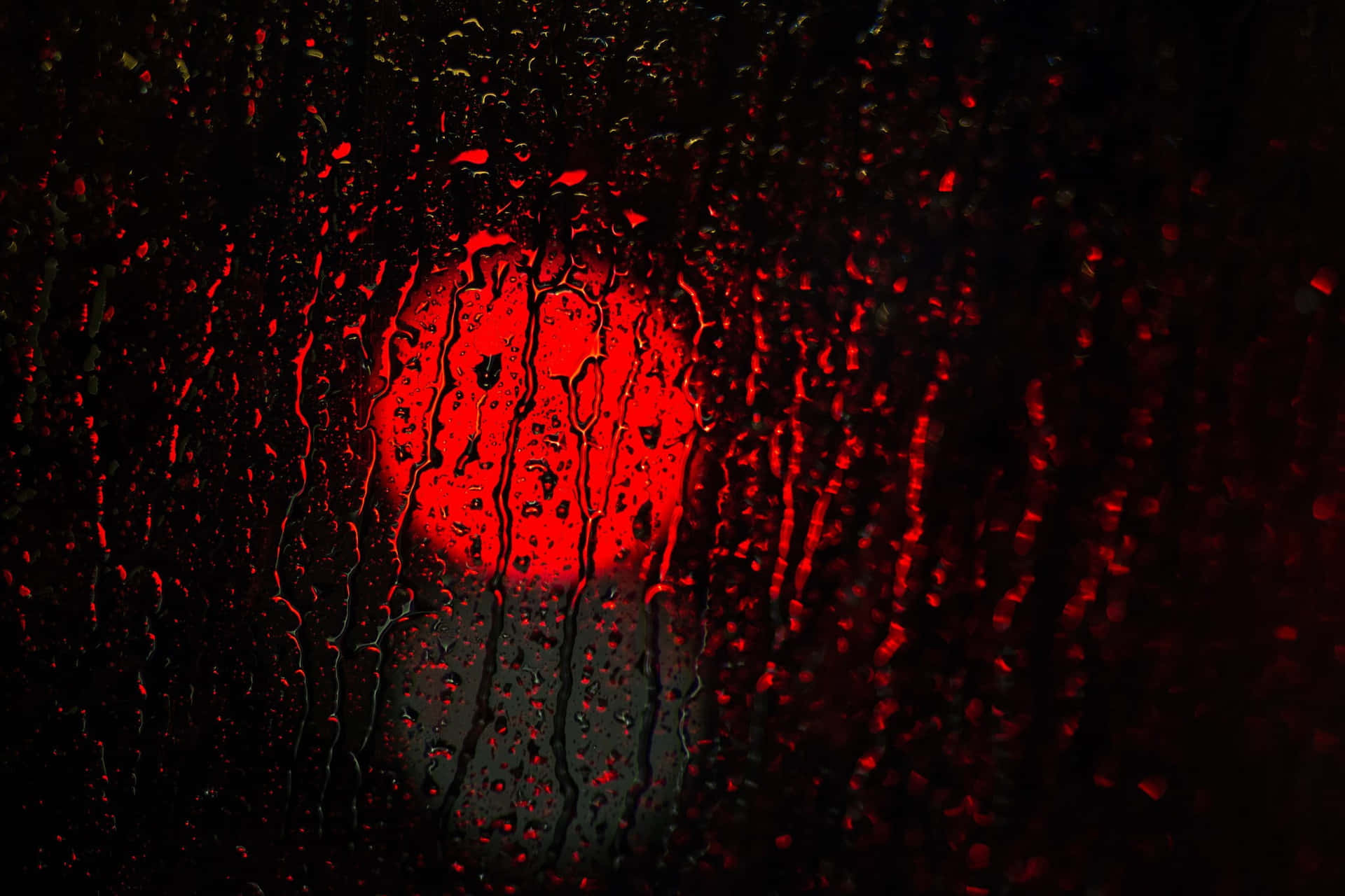 Crimson_ Raindrops_on_ Glass Background