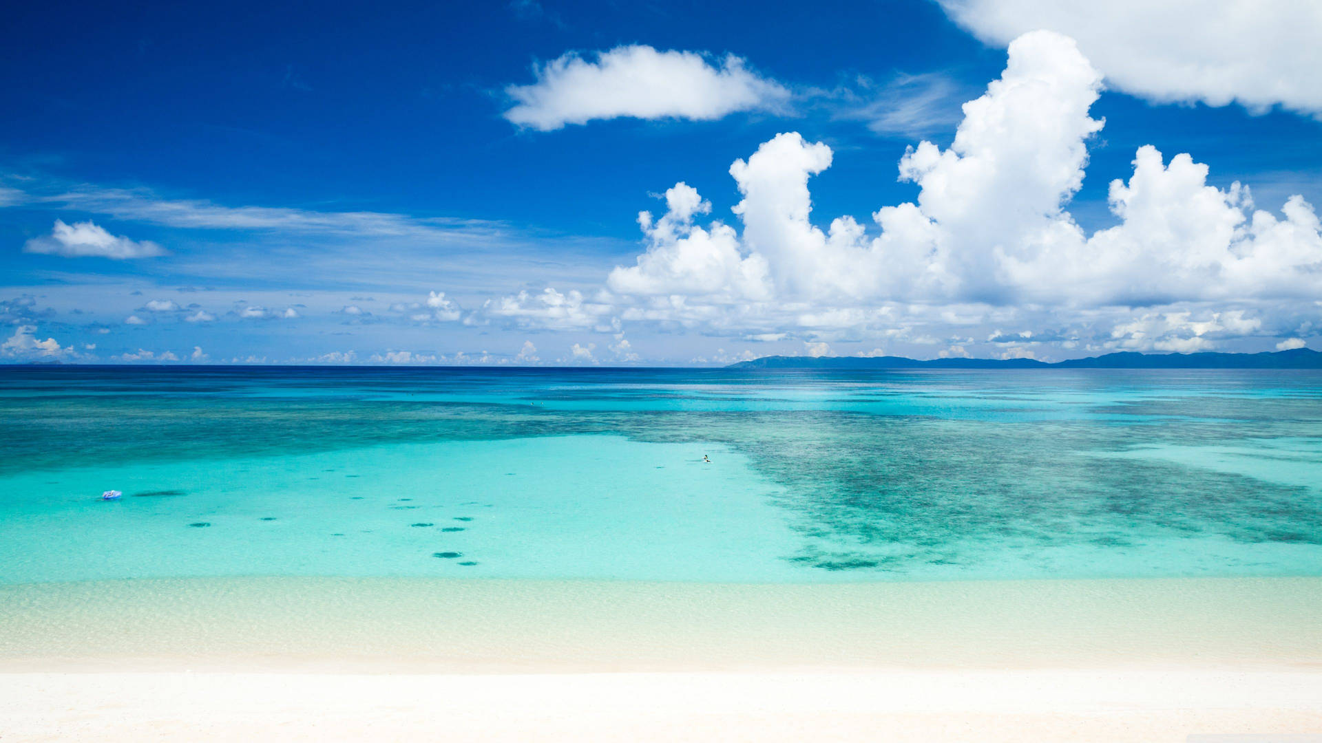 Crisp Blue Between Sand And Sea Background