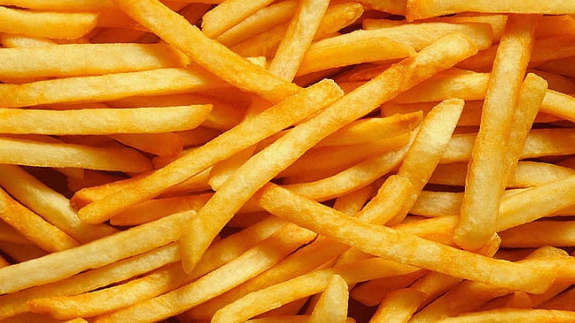 Crispy Golden French Fries Background