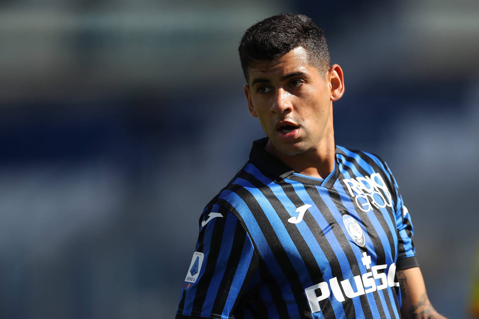 Cristian Romero In Blue And Black