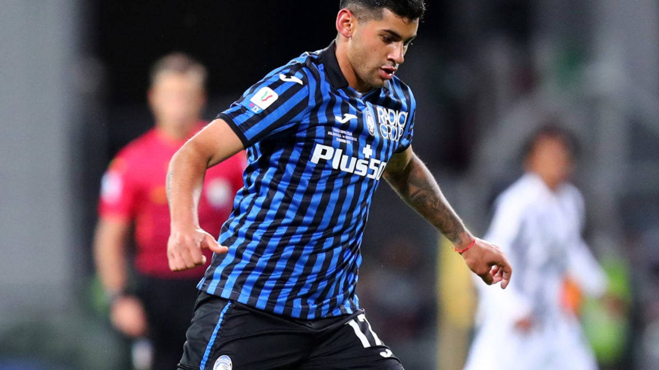 Cristian Romero Inside A Football Stadium Background