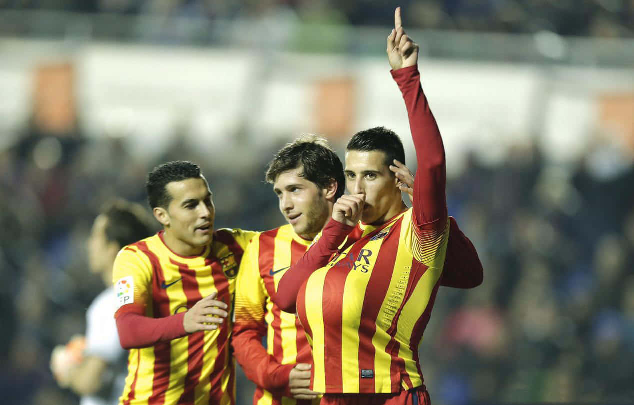 Cristian Tello Celebrating Goal With Teammates Background