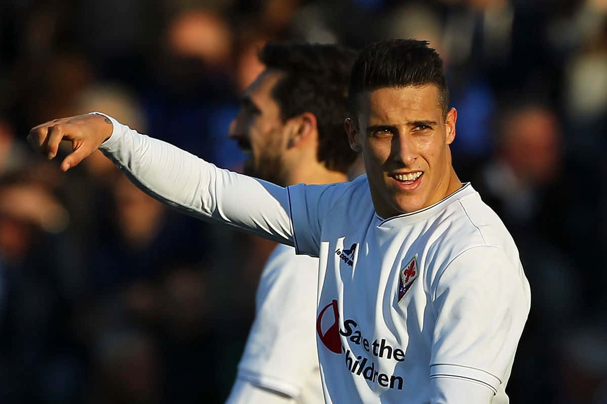 Cristian Tello Pointing During Match Background
