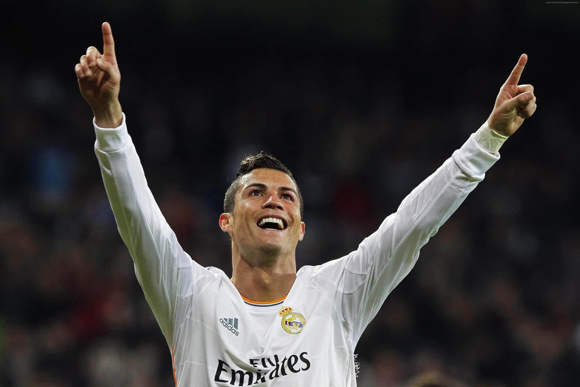 Cristiano Ronaldo Dribbling The Ball During A Professional Soccer Match Background