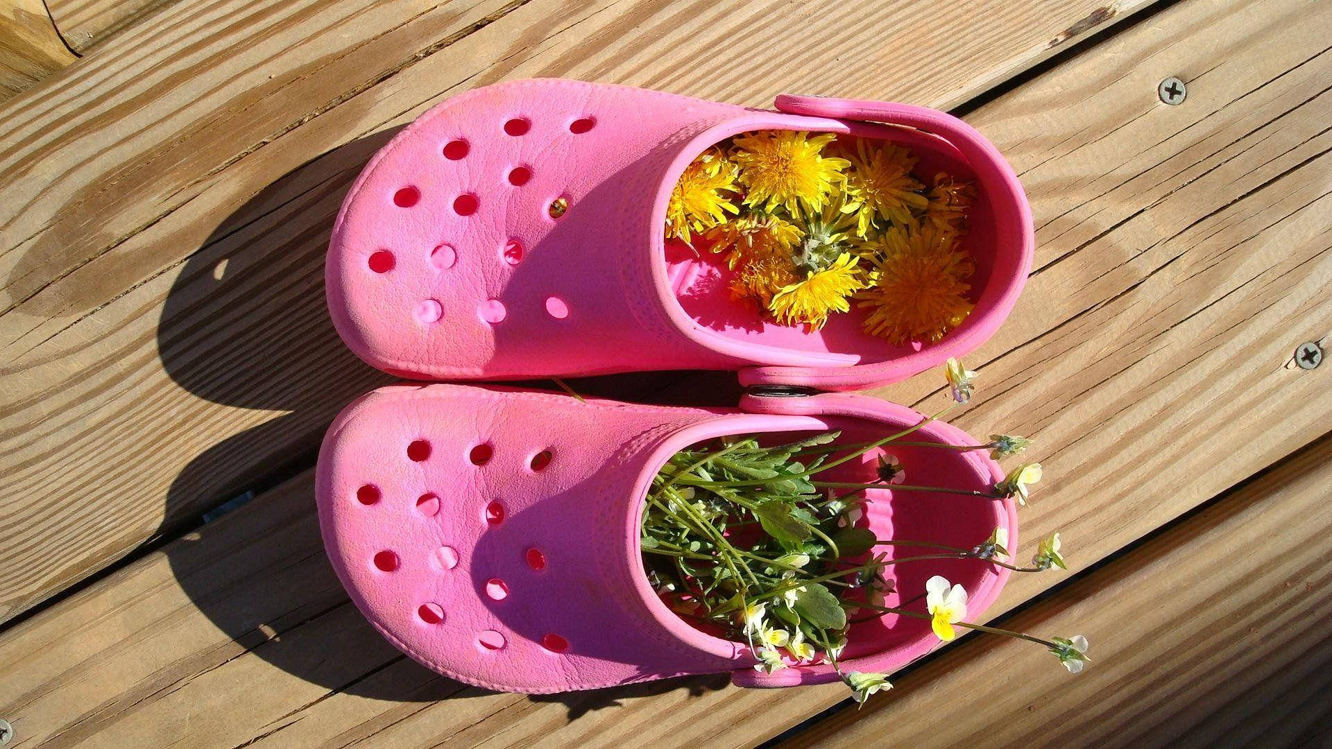 Crocs Footwear With Flowers Background