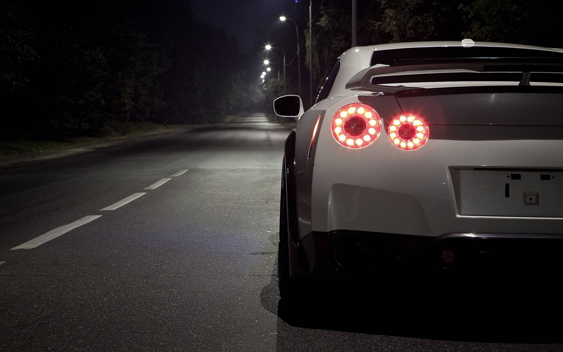 Cropped Photo Of A White Nissan Gtr Car Background