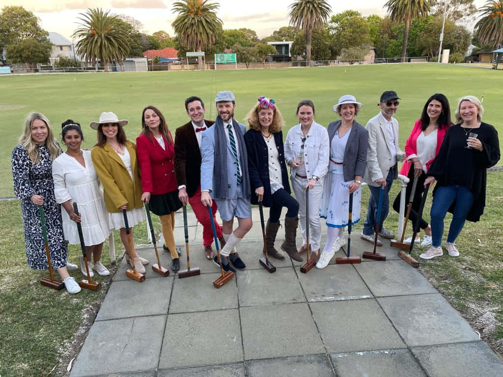 Croquet Players Gathering Outdoors Background