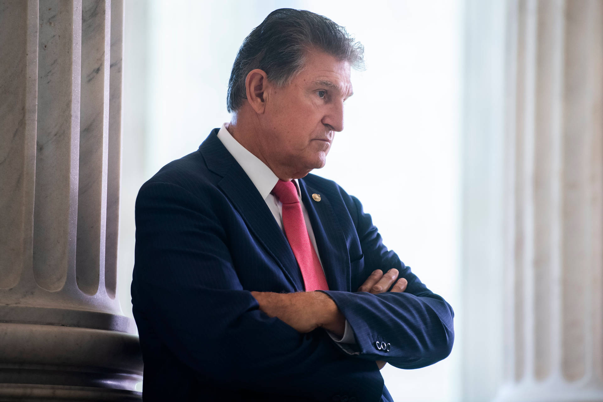 Cross-armed Joe Manchin Background