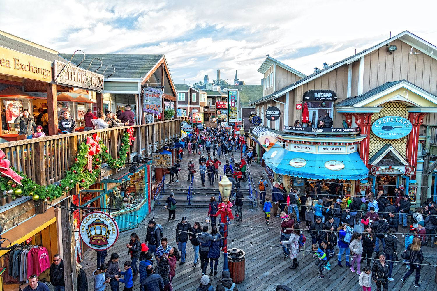 Crowds Of People In Fishermans Wharf Background