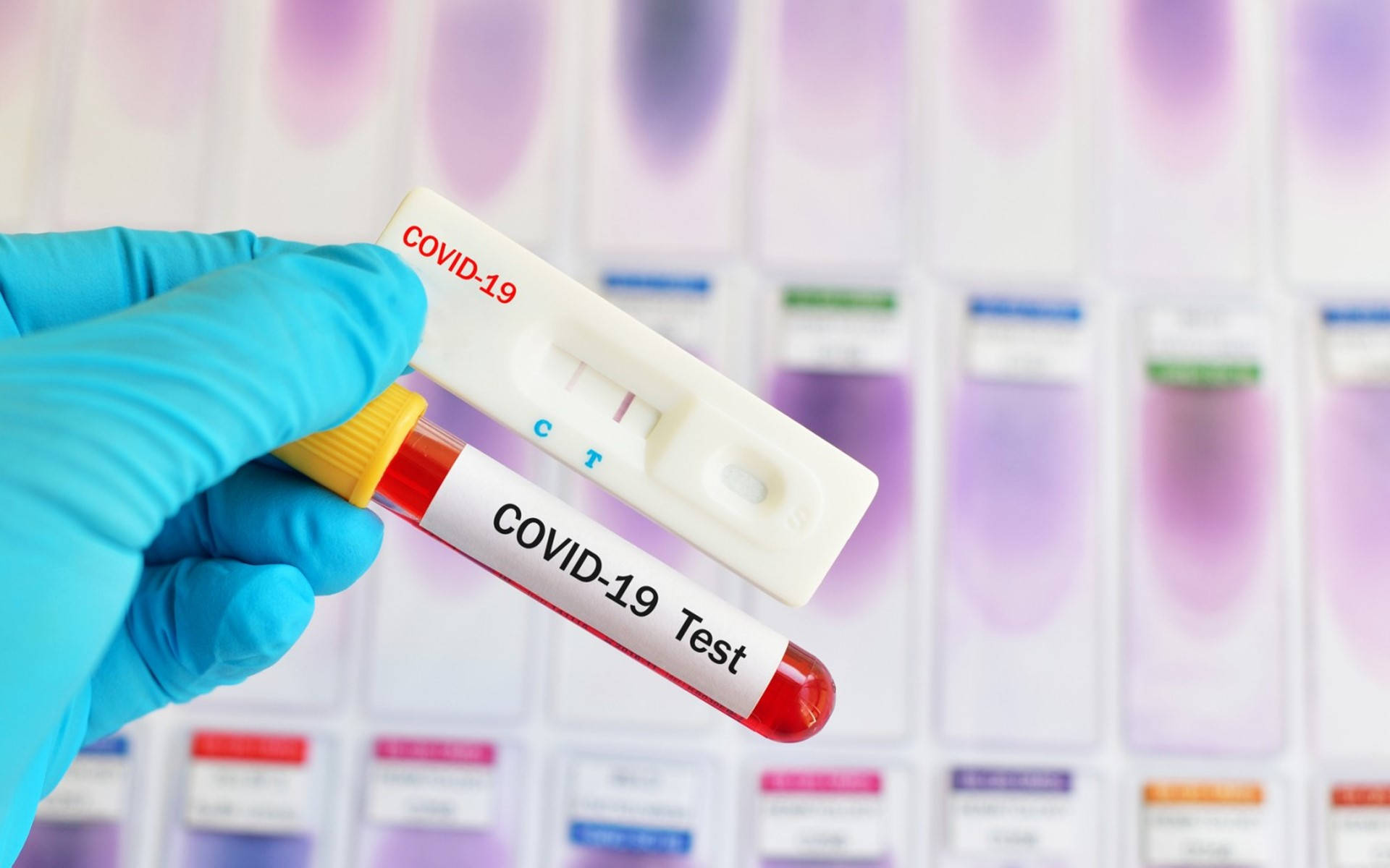 Crucial Covid-19 Test Kit With Red Vial Background