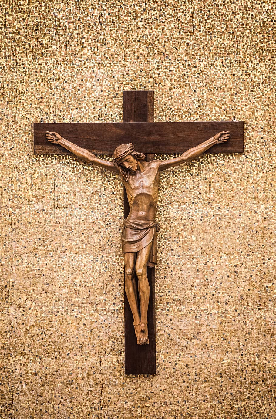 Crucifixion Statue Against Mosaic Background Background