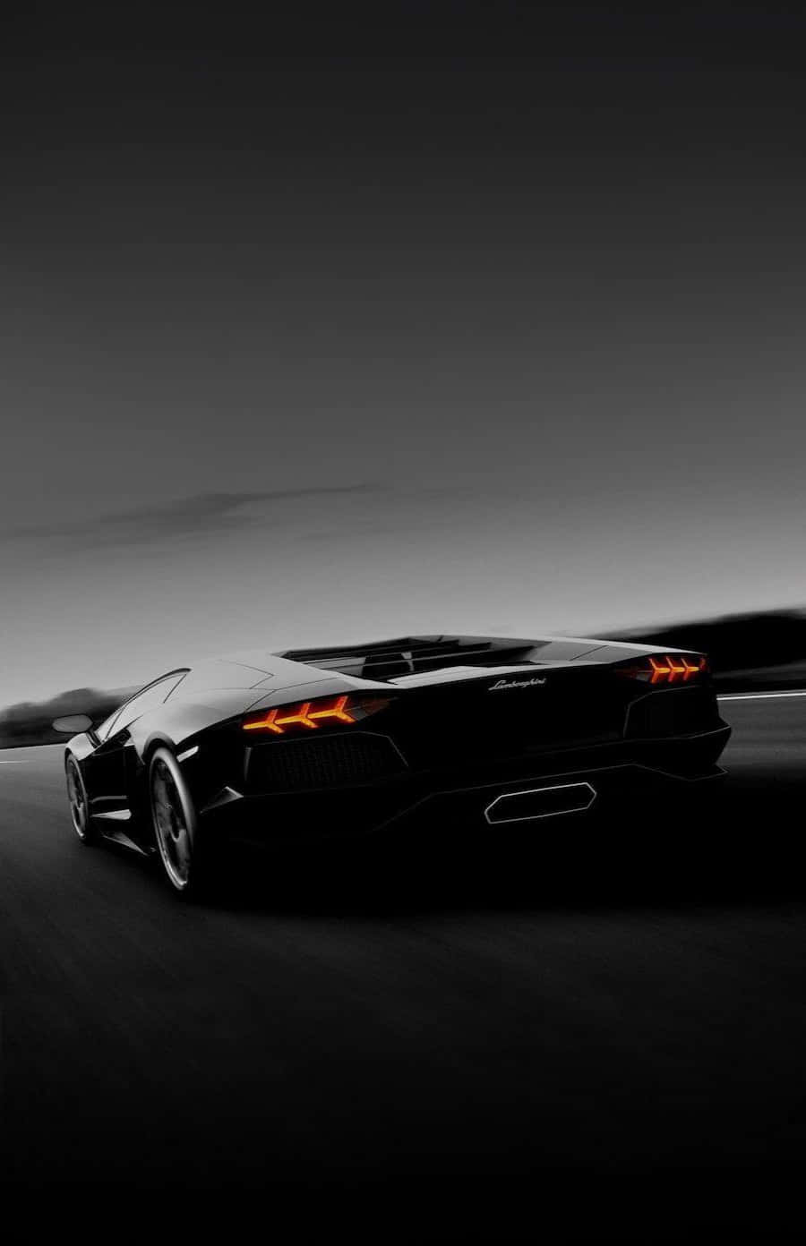 Cruise Down The Autobahn In Style In A Black Lamborghini. Background