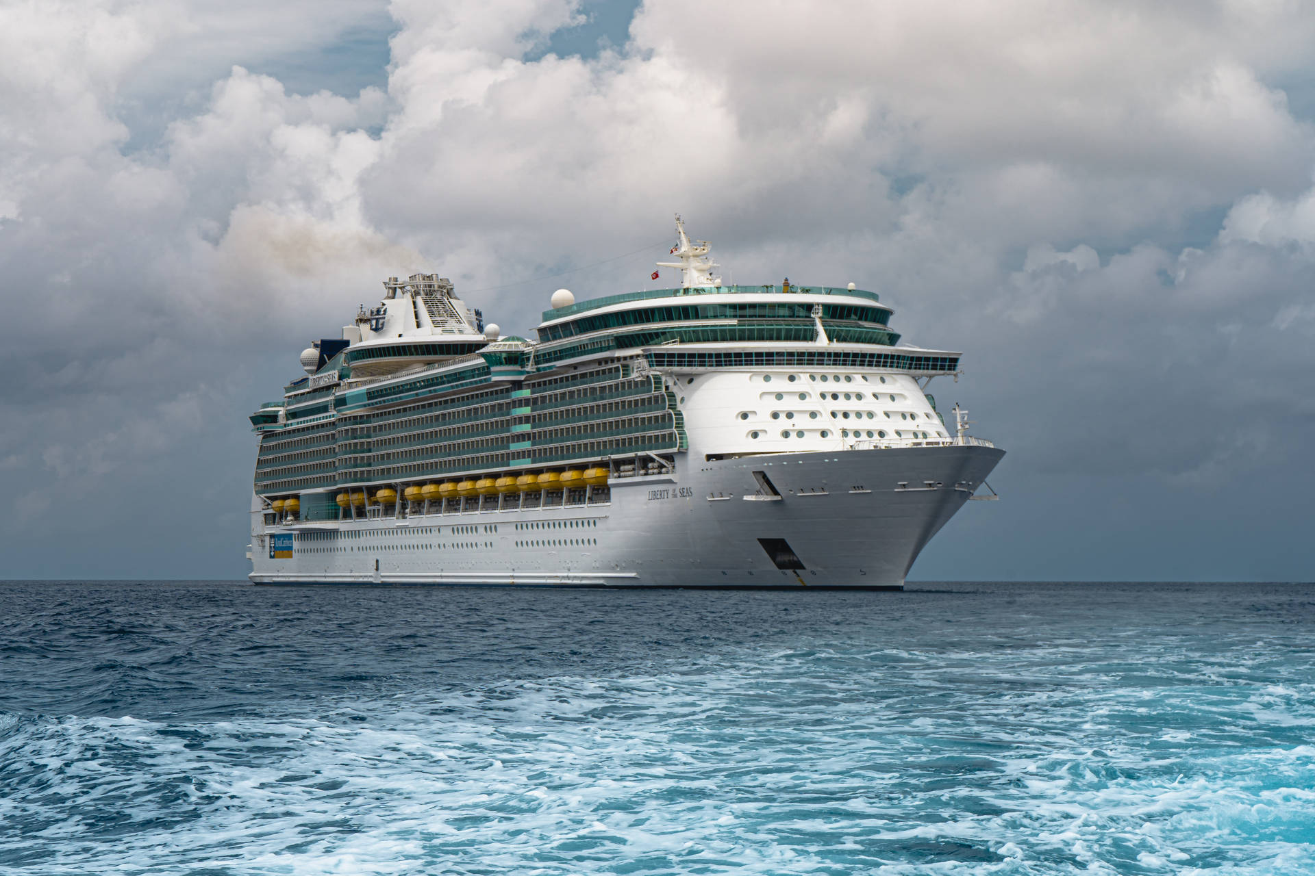 Cruise Ship In Cloudy Sky Background