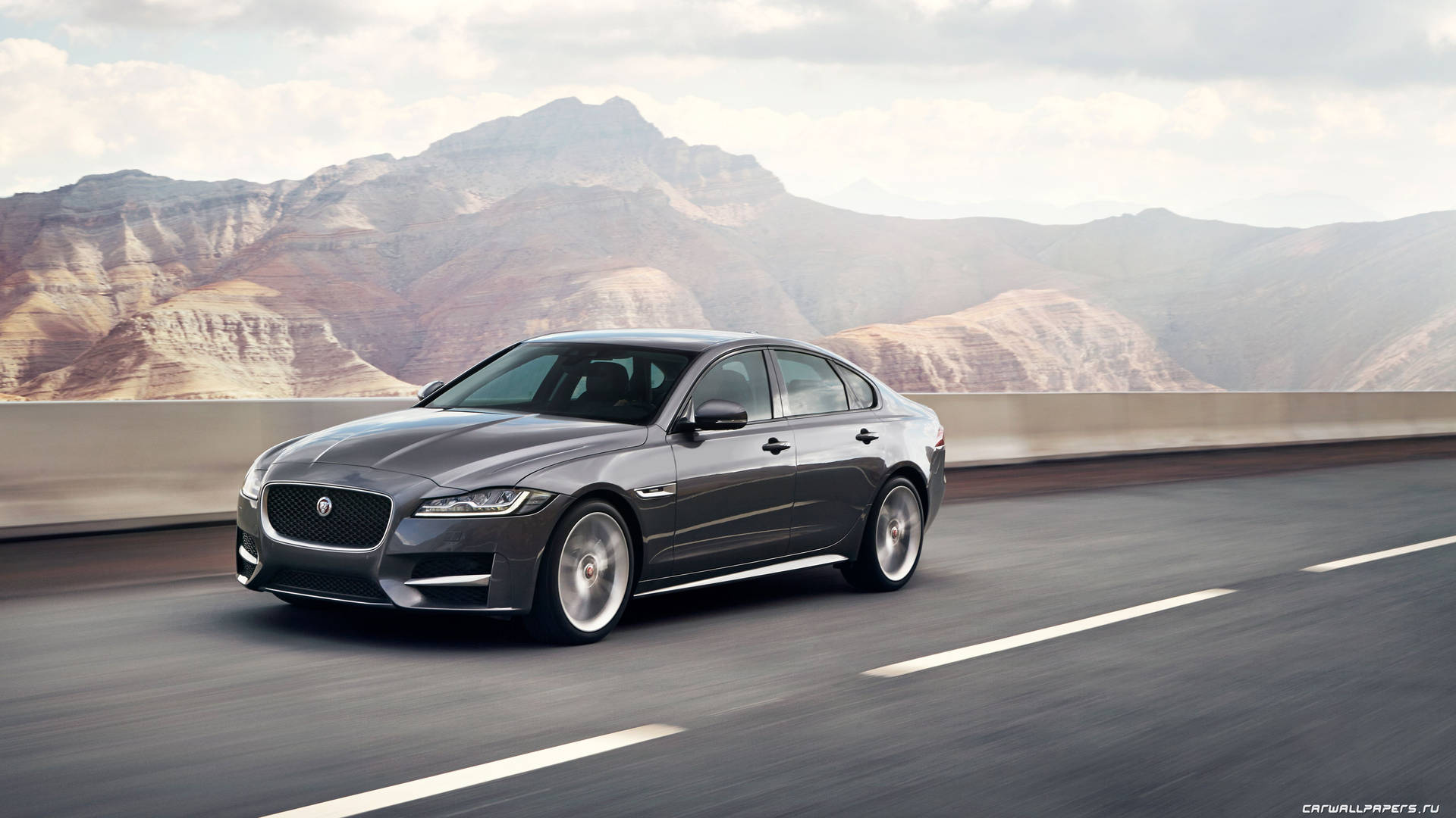 Cruising The Road In Style In A Grey Jaguar