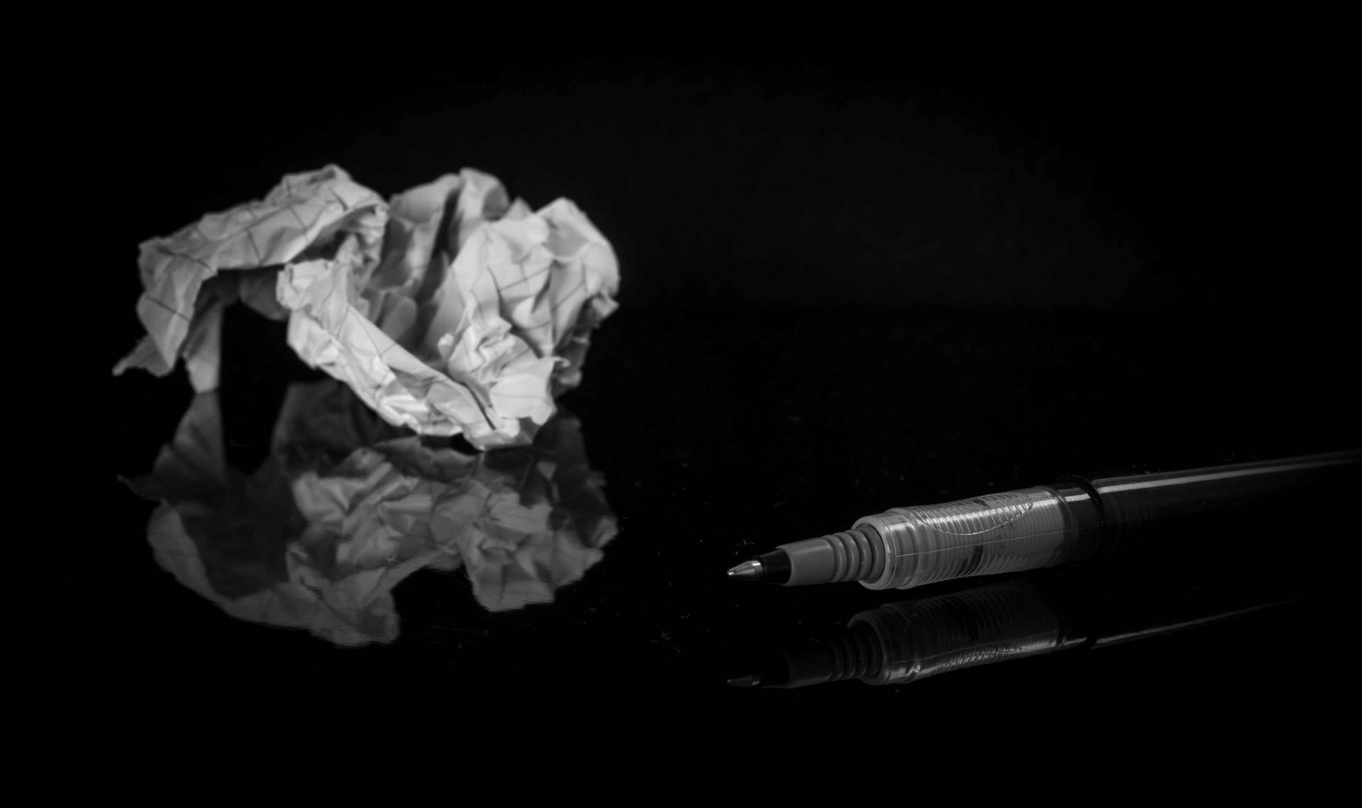 Crumpled Paper And Pen Background