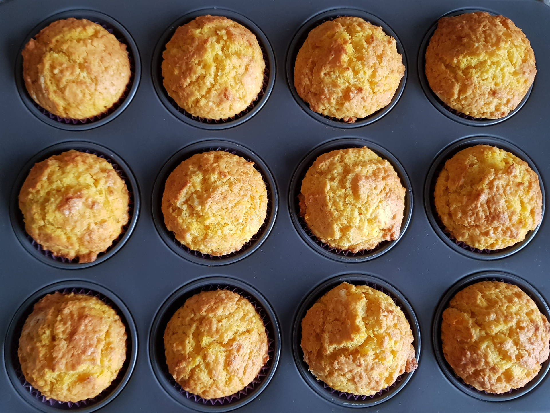 Crunchy Muffins On Baking Pan Background