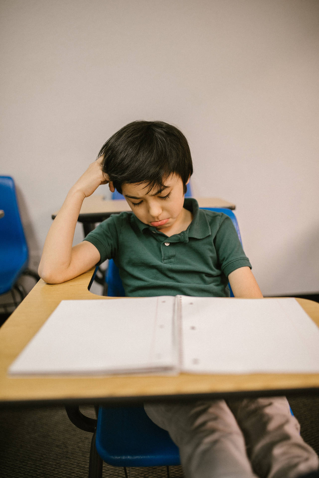 Crying Sad Boy On Desk Background