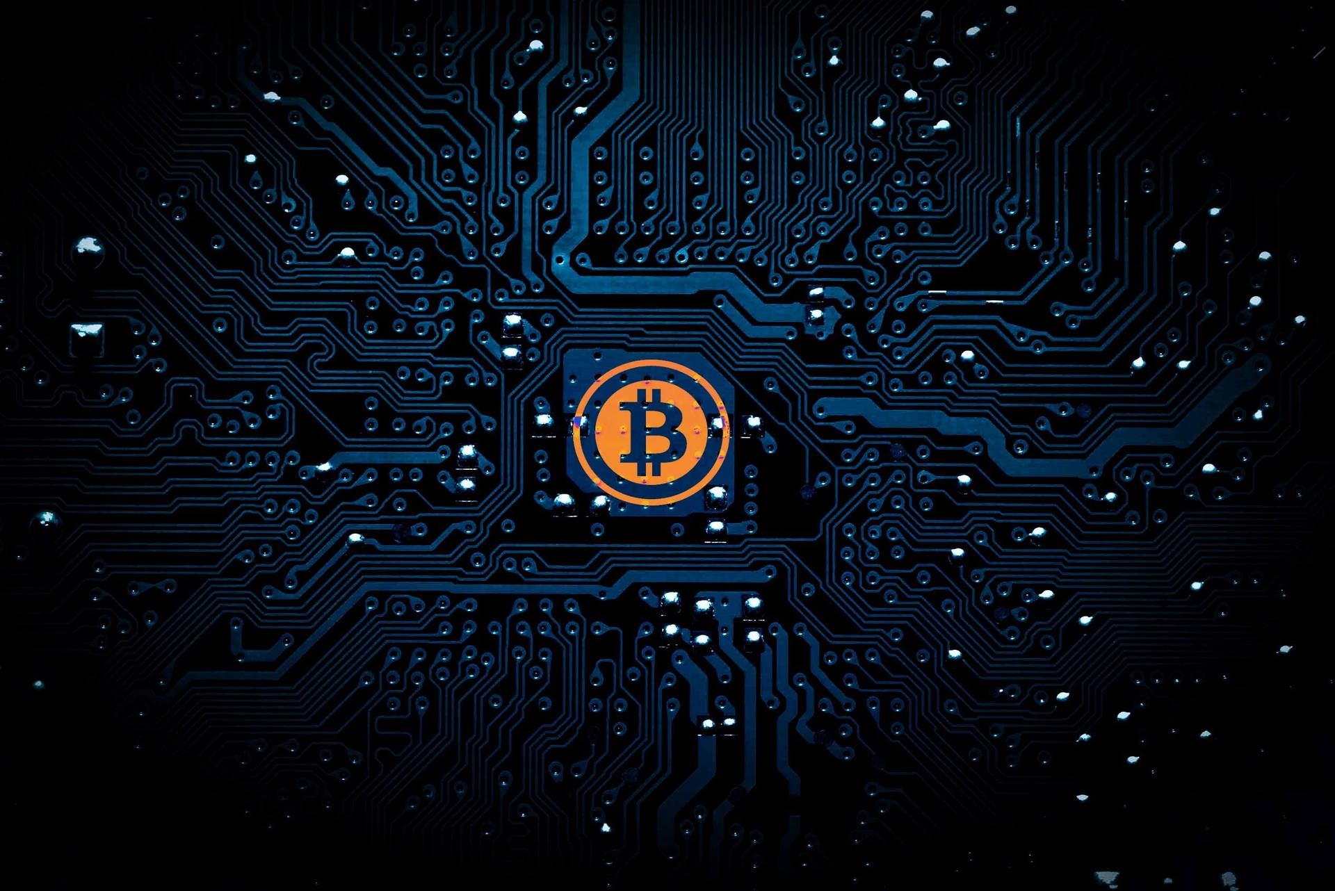 Crypto Bitcoin On Dark Teal Motherboard Background