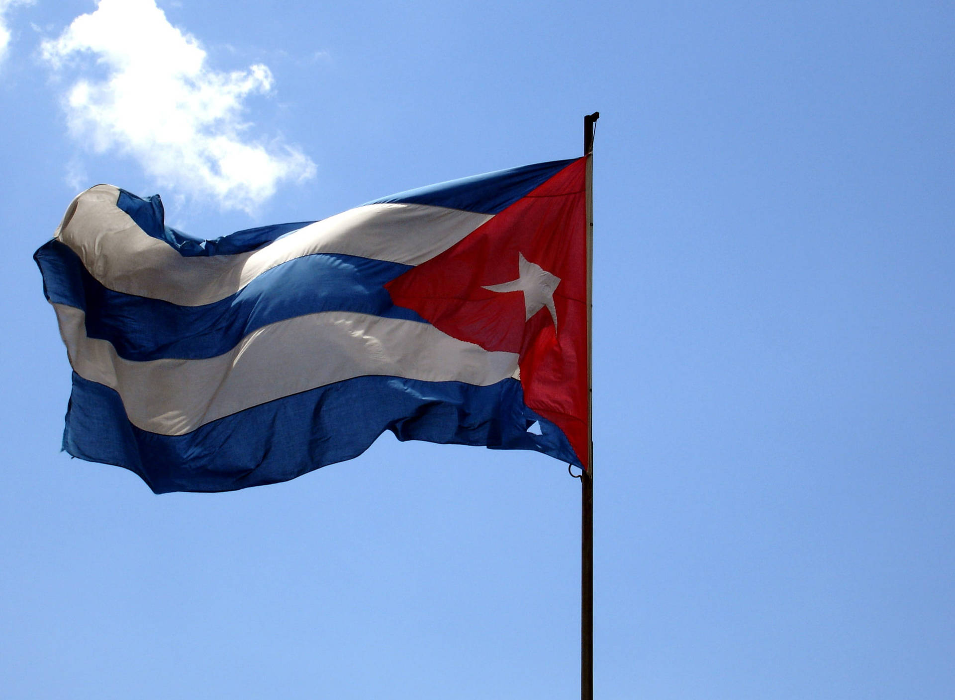 Cuban Flag With Clouds Background