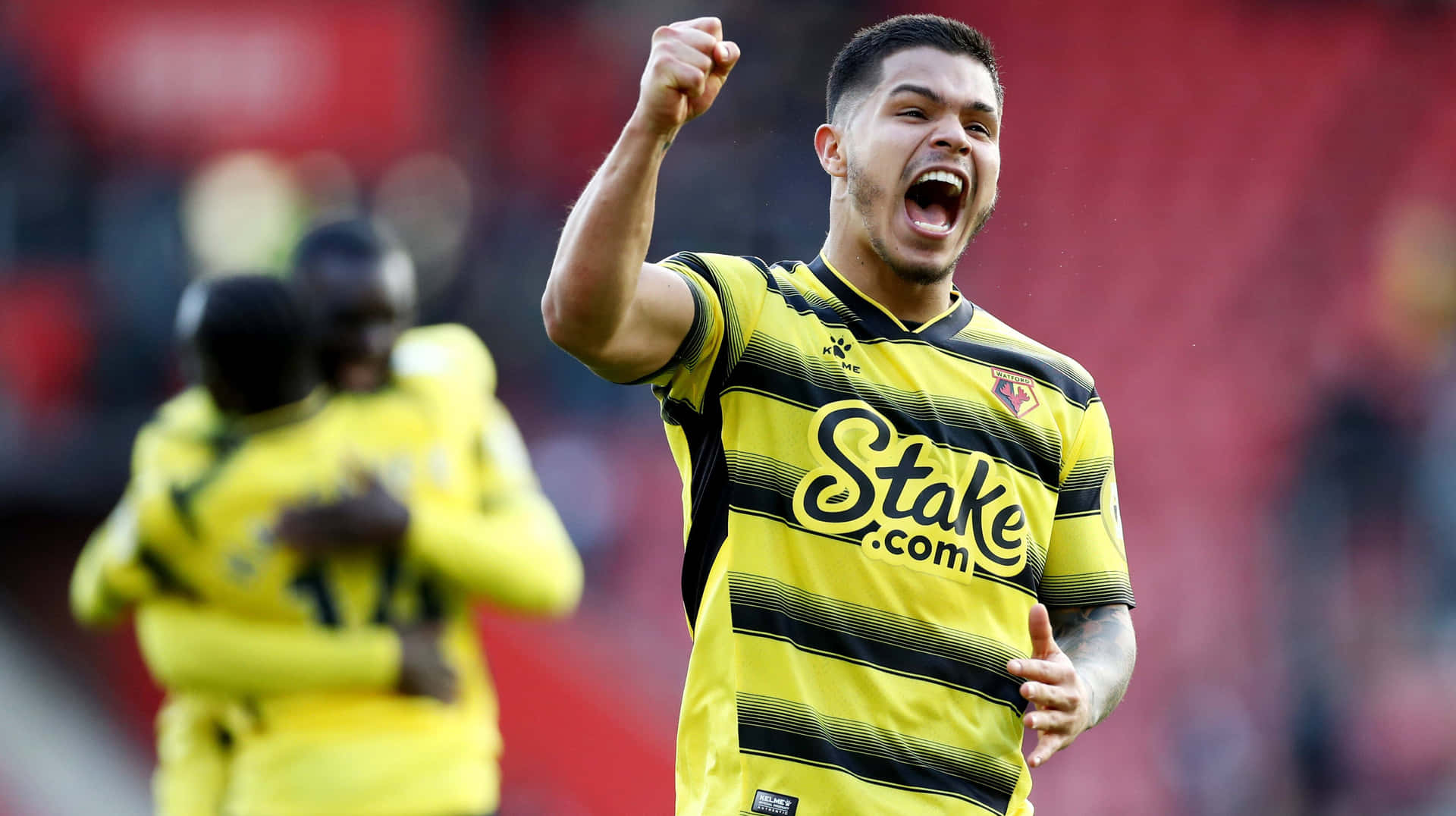Cucho Hernandez Celebrating In A Premier League Match Background