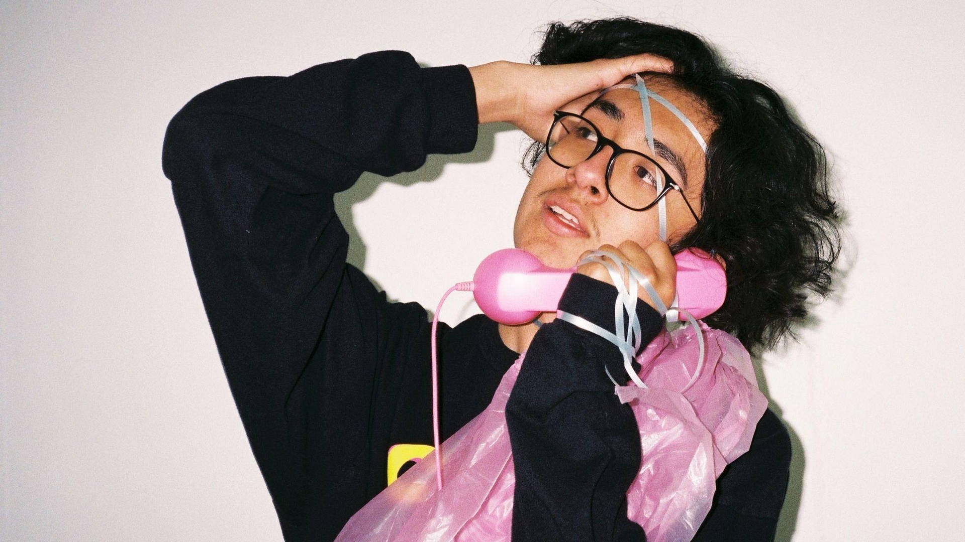 Cuco Is Captured On The Telephone Background