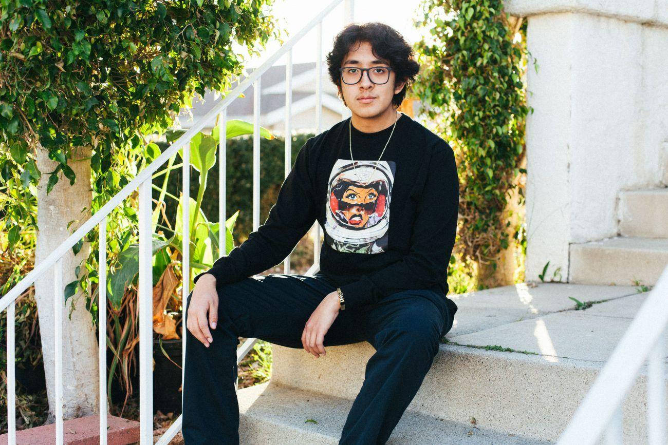 Cuco Sitting On The Stairs Background