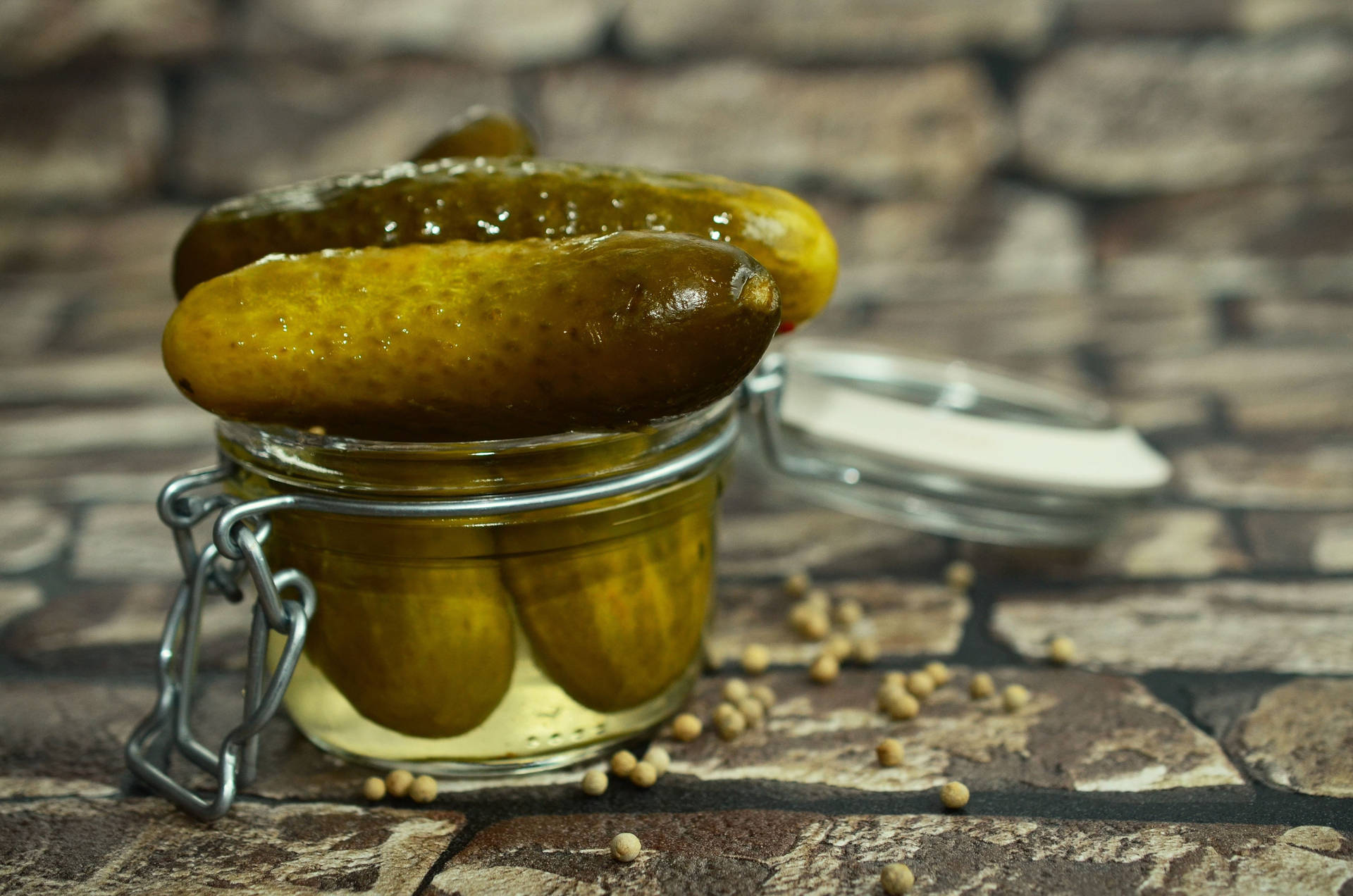 Cucumber Pickles In Tiny Jar Background