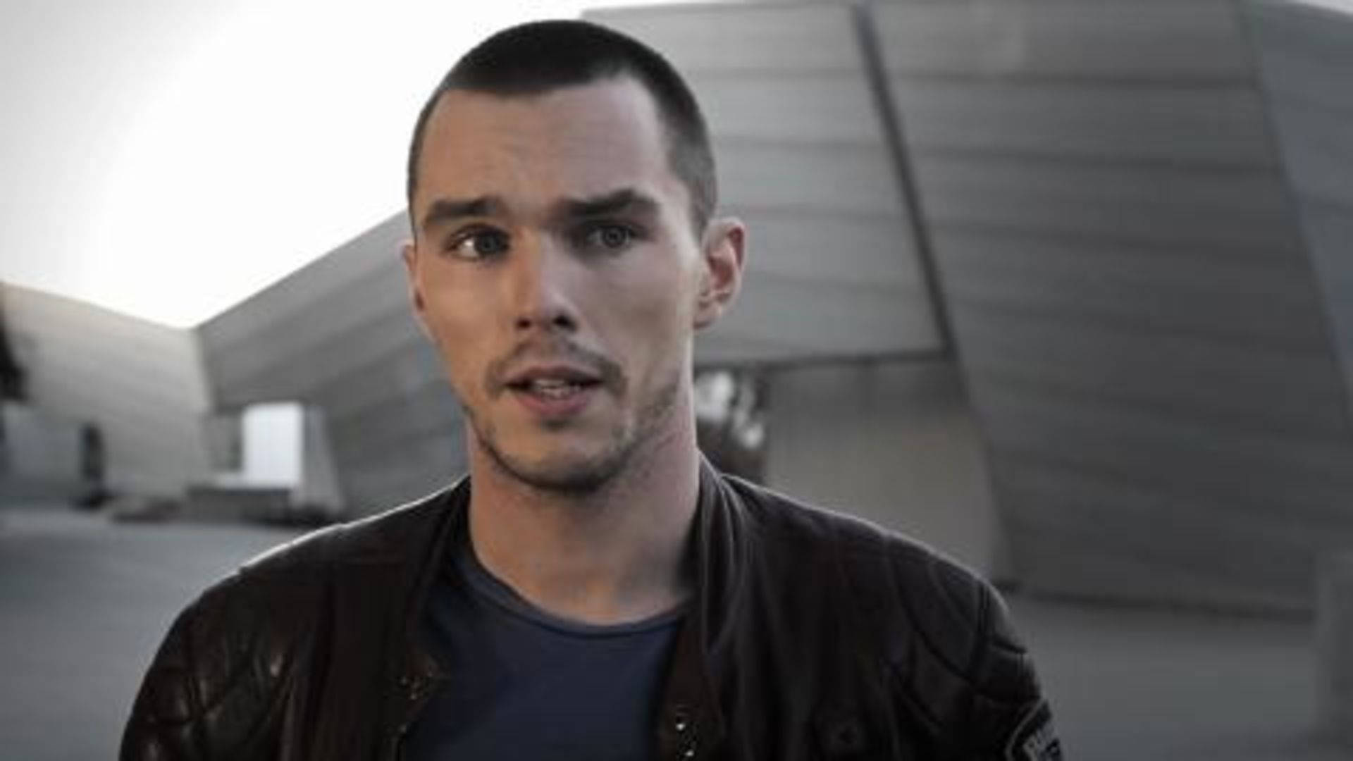 Curious Expression Of Nicholas Hoult Background