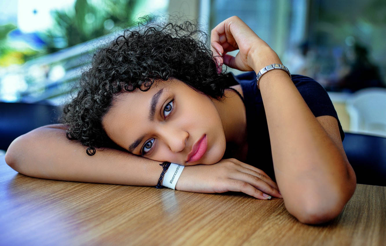 Curly Haired Teenager Sad Eyes Background