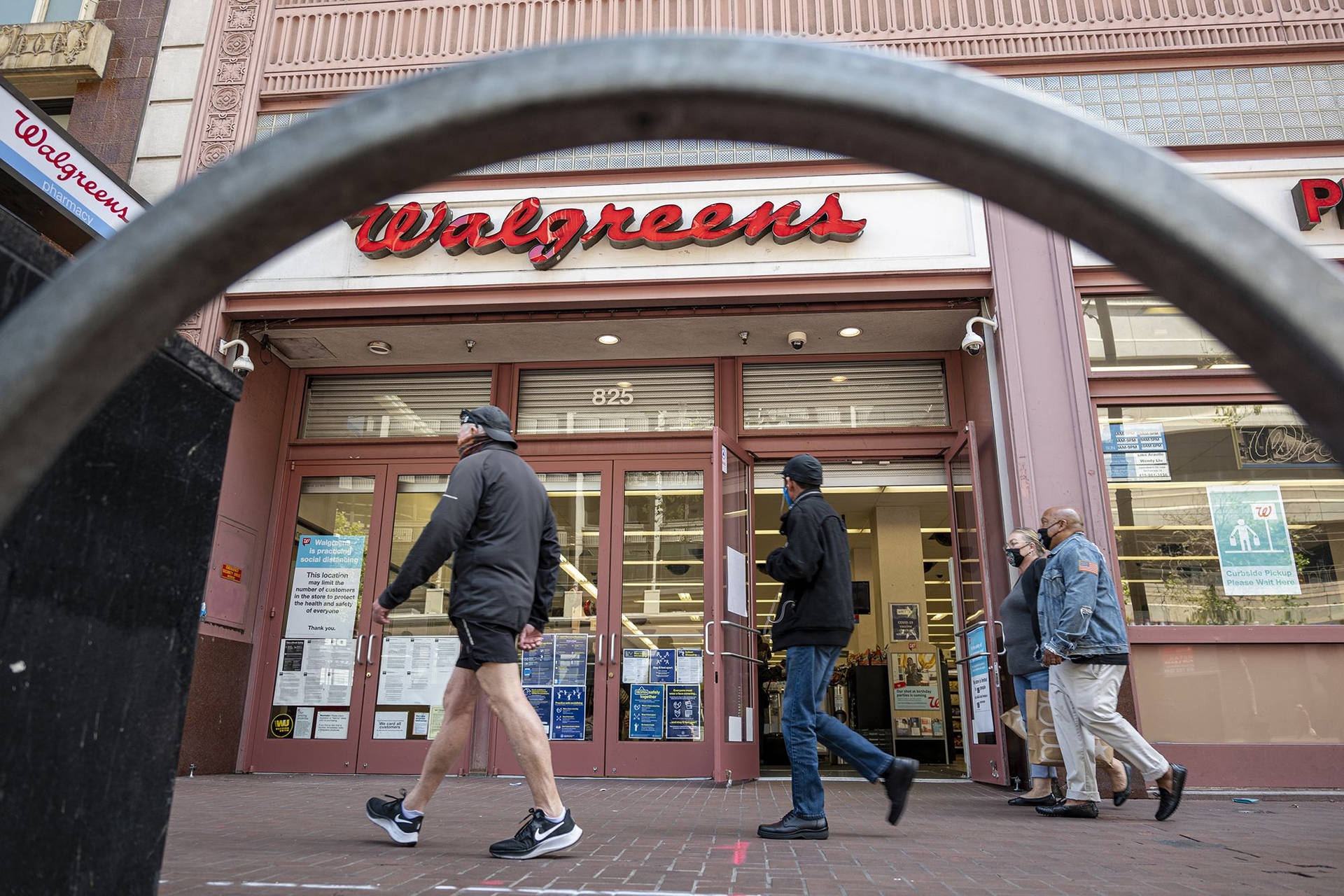 Customers Shopping At A Bustling Walgreens Store Background