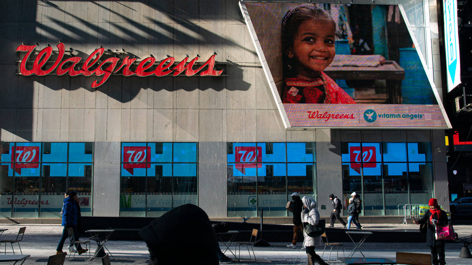 Customers Visiting A Local Walgreens Store Background