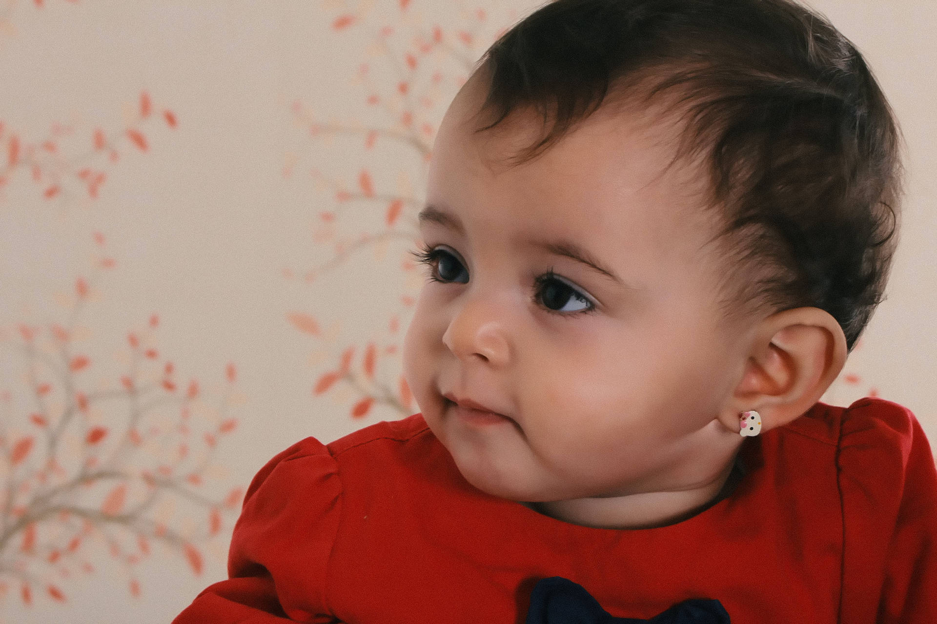 Cute Attentive Baby Girl In Red