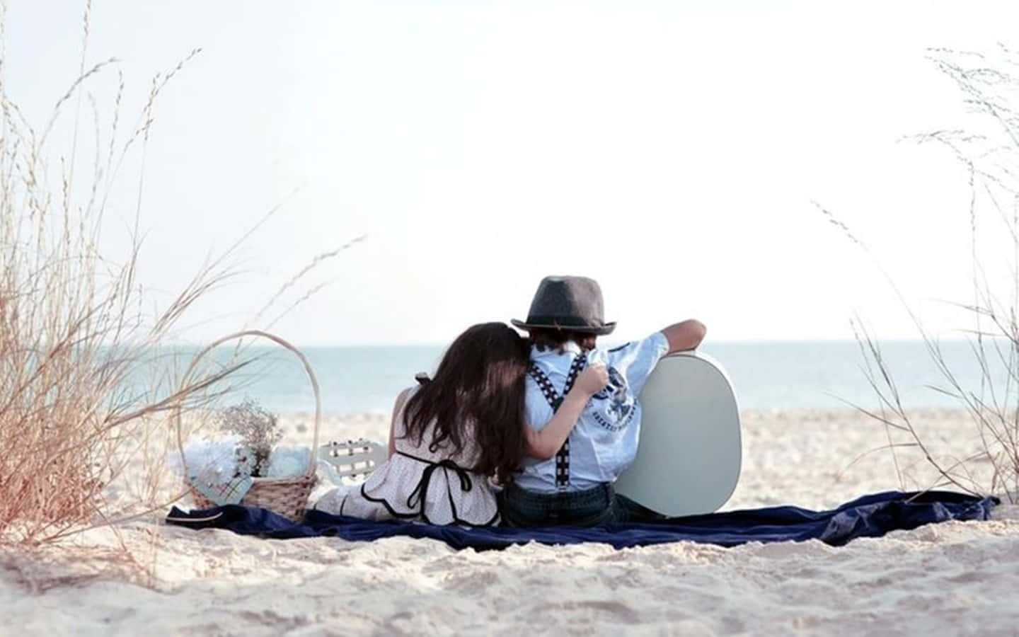 Cute Baby Couple Beach Date With Guitar Background