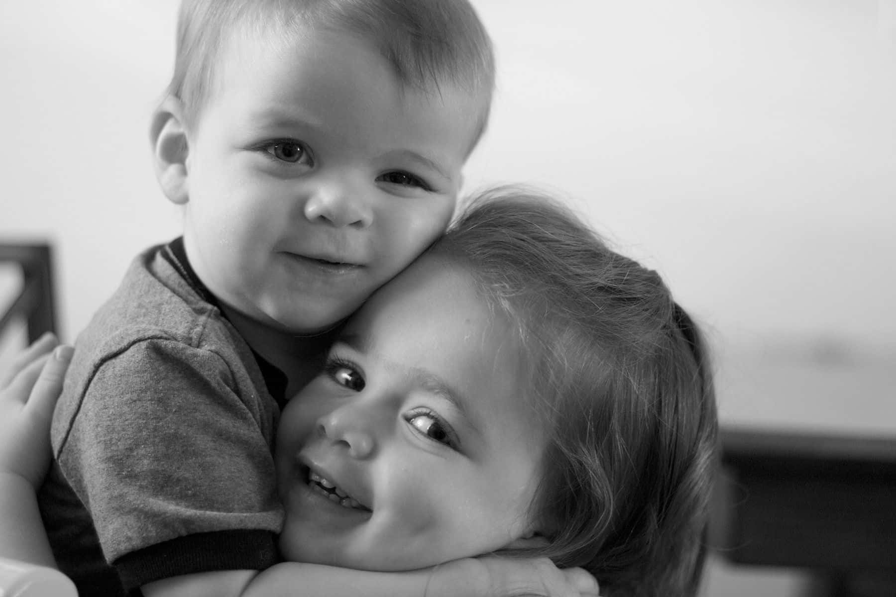 Cute Baby Couple Cuddling Black & White Background