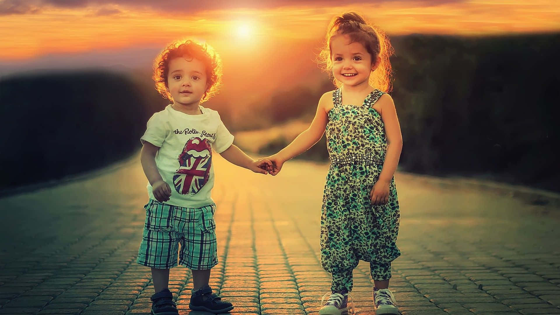 Cute Baby Couple Holding Hands Sunset Background