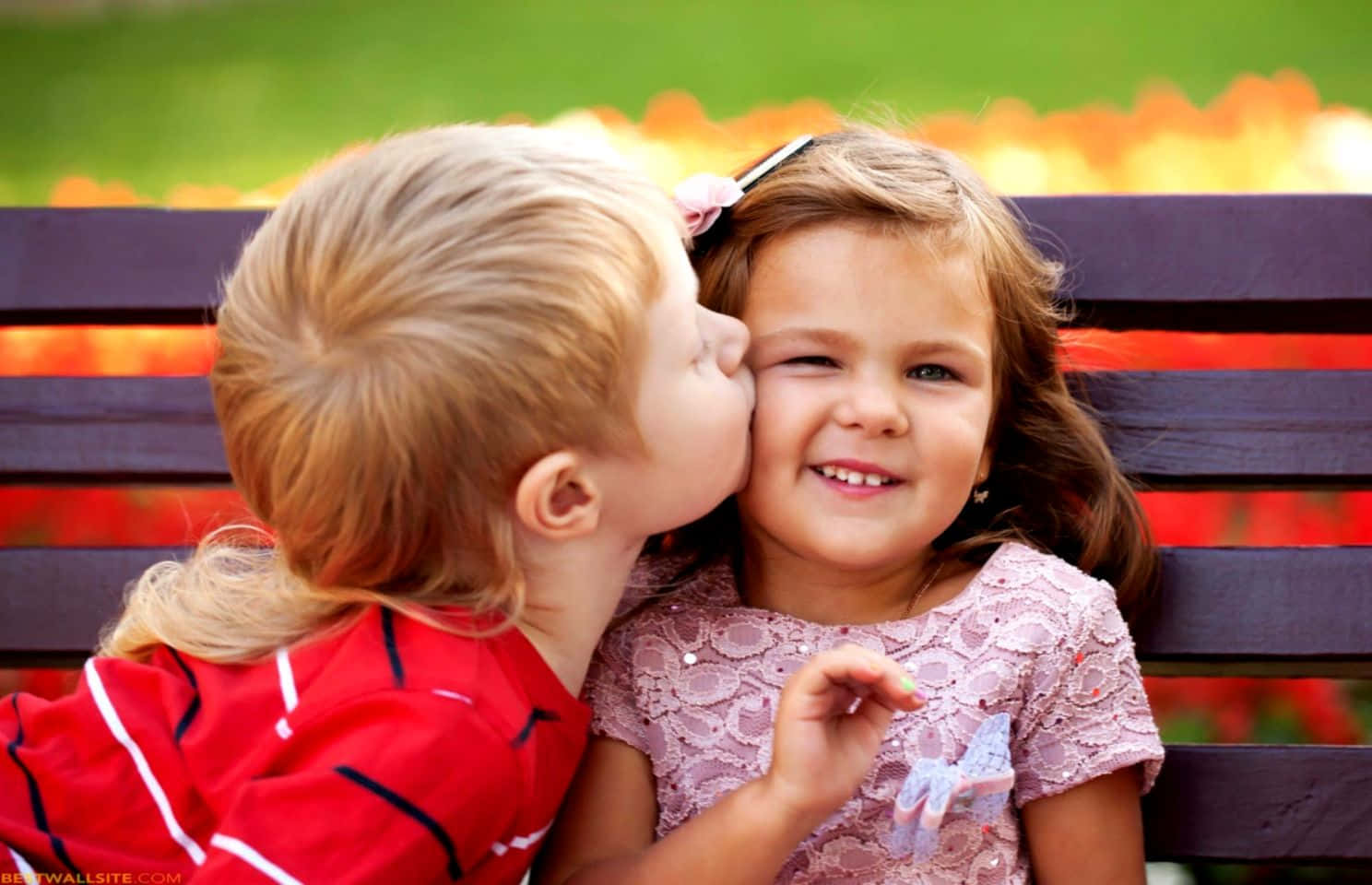 Cute Baby Couple Kiss At The Park Background