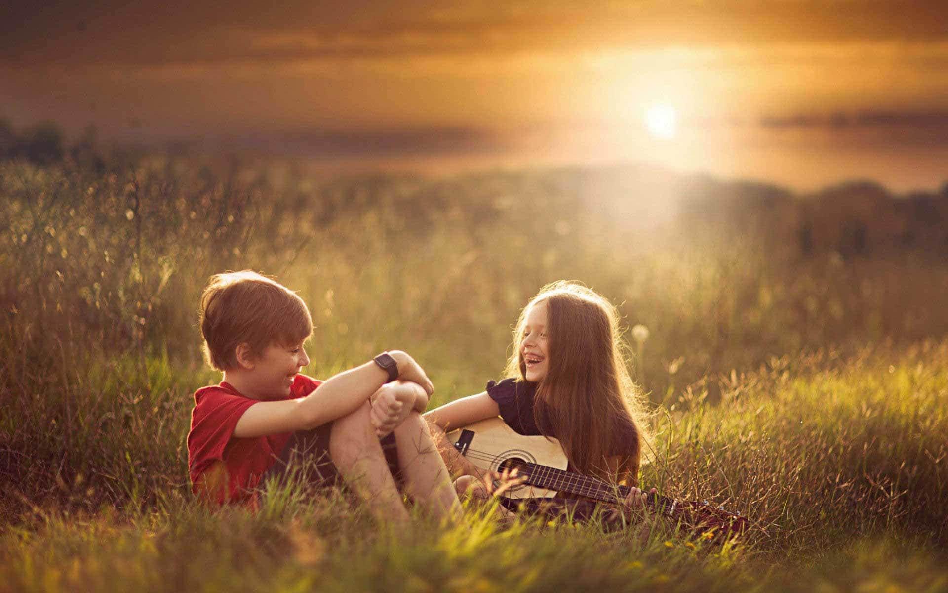 Cute Baby Couple Playing Guitar Sunset Background