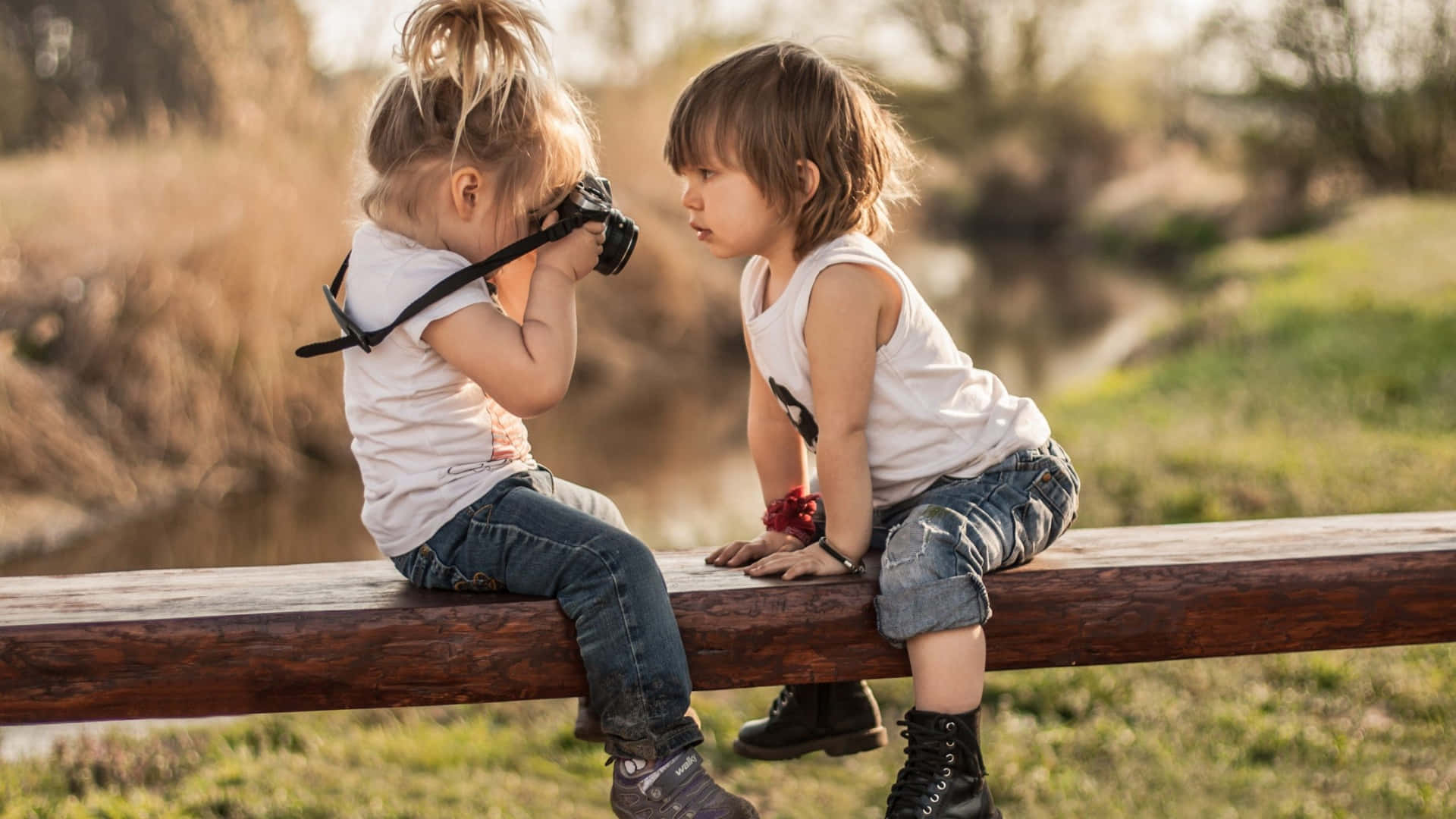 Cute Baby Couple Taking Pictures Background