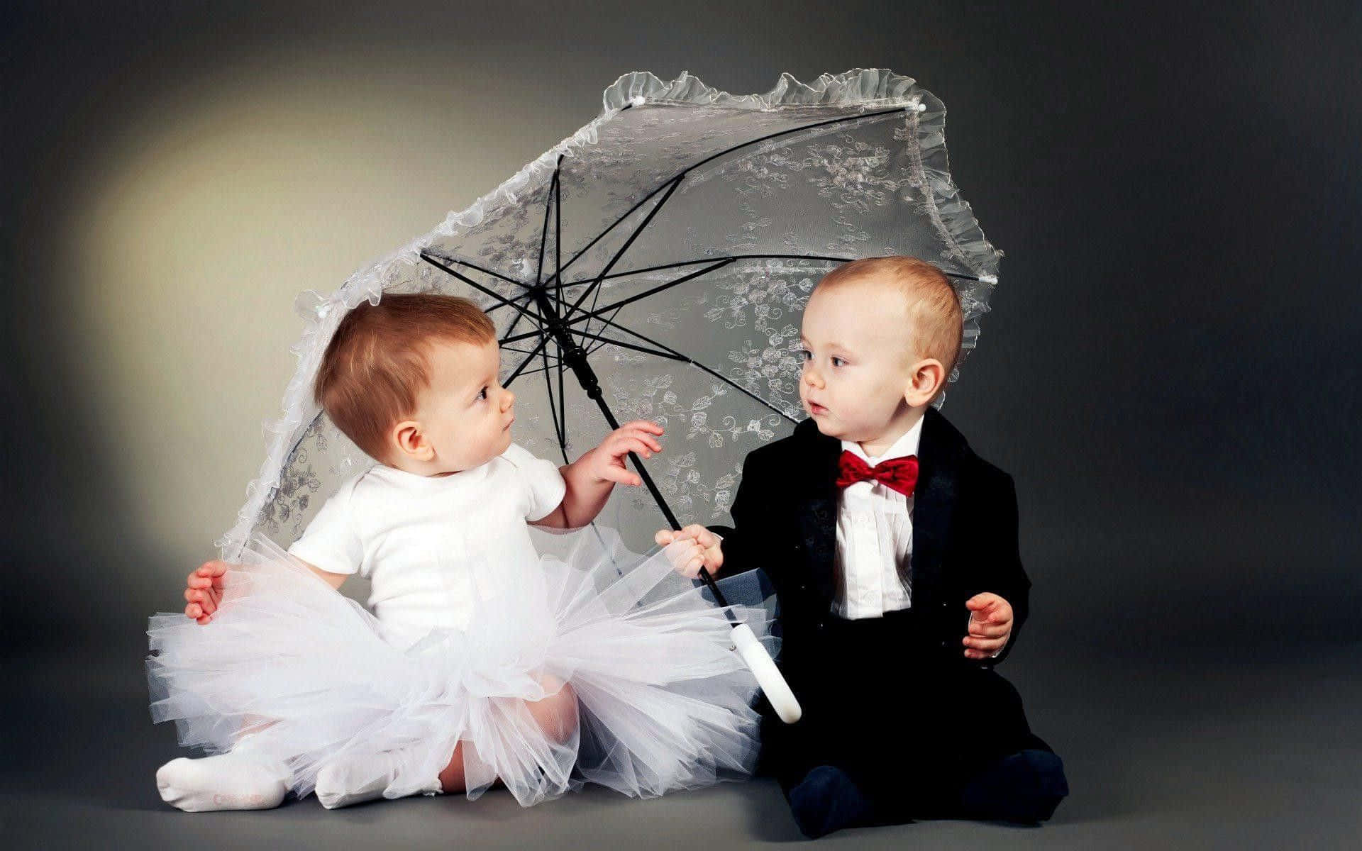 Cute Baby Couple With Umbrella Background