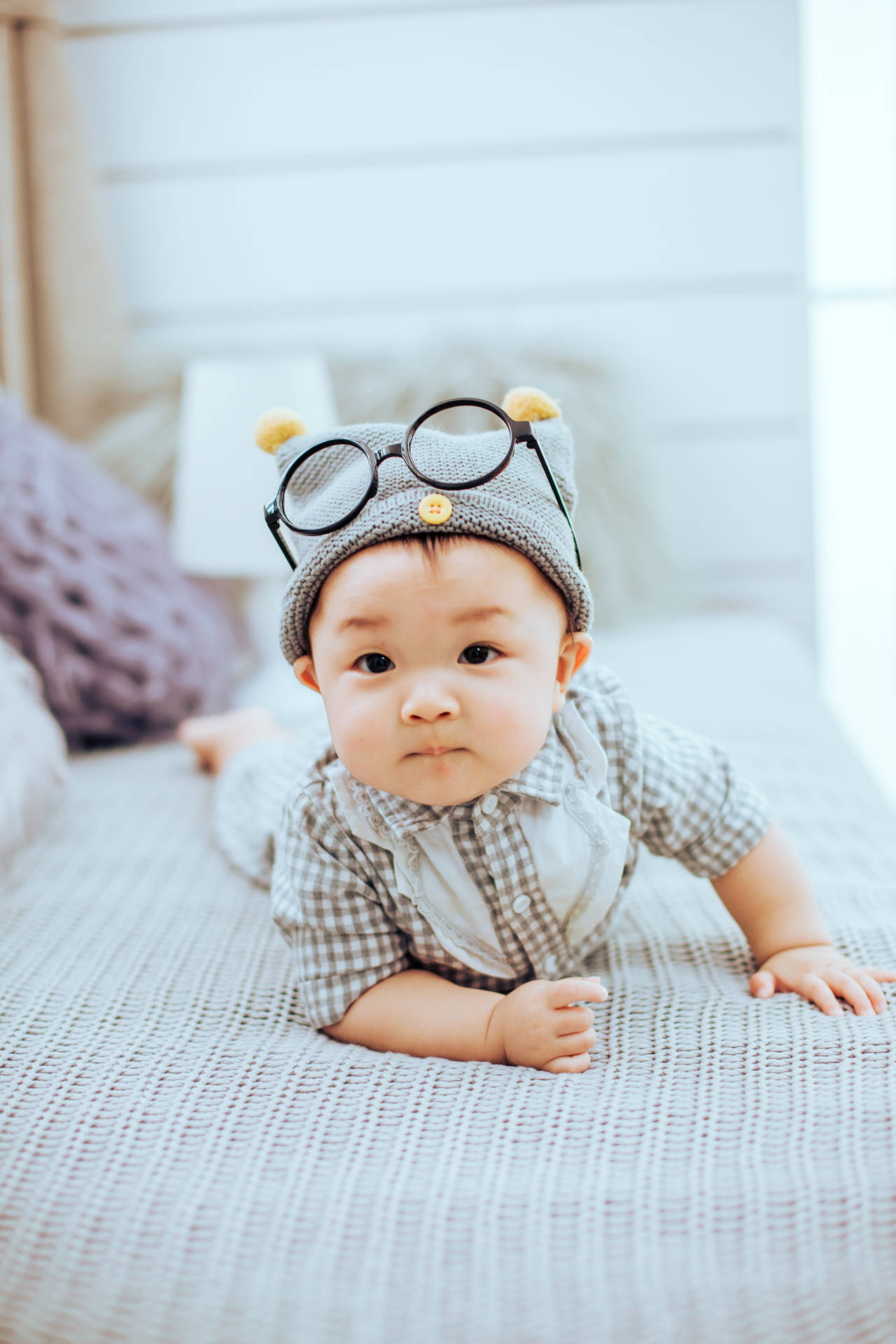 Cute Baby On Bed With Eyeglasses