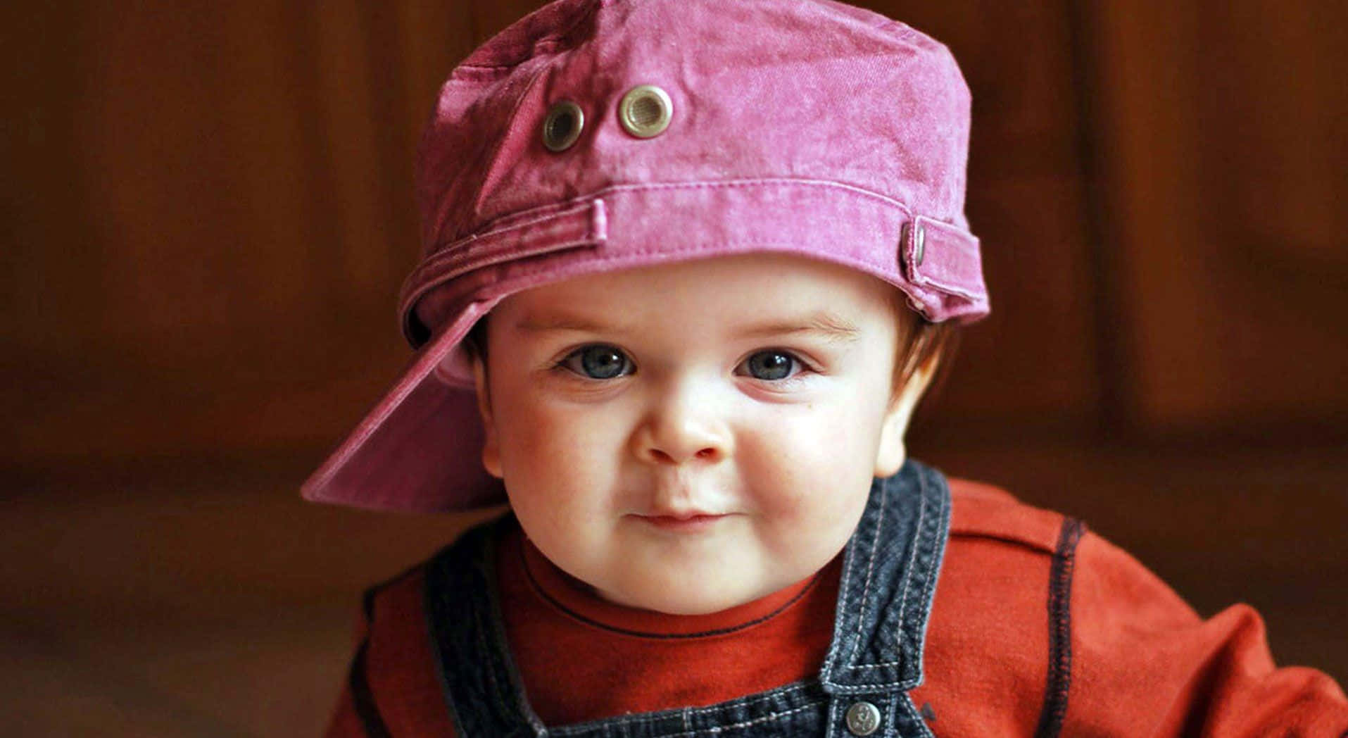Cute Baby Wearing A Cap