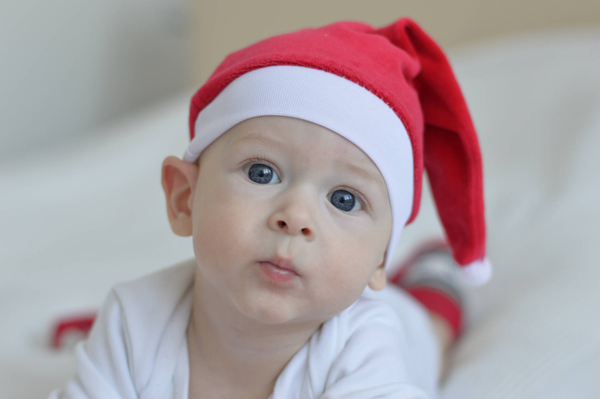 Cute Baby With Red Santa Hat Background